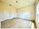 Neutral bedroom featuring a window, a closet, tile floors, and neutral paint at 2427 Continental Blvd, Orlando, FL 32808