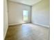 Neutral bedroom featuring a window, tile floors, and neutral paint at 2427 Continental Blvd, Orlando, FL 32808