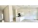 Bright kitchen with stainless steel appliances, a center island, and white cabinets at 2427 Continental Blvd, Orlando, FL 32808