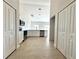 Open kitchen featuring white cabinets, stainless steel appliances, and tile floors at 2427 Continental Blvd, Orlando, FL 32808