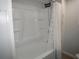 Modern bathroom with a new shower and tiled walls at 2618 Brookside Cir, Mount Dora, FL 32757