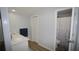 Bathroom showcasing a sleek vanity, closet and a shower with decorative curtain at 2618 Brookside Cir, Mount Dora, FL 32757
