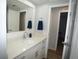 Bathroom features a solid surface vanity top and stylish towel at 2618 Brookside Cir, Mount Dora, FL 32757
