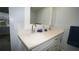 Bathroom features a dual sink vanity with white cabinets and quartz countertop at 2618 Brookside Cir, Mount Dora, FL 32757