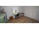 Bedroom features a sewing machine, wood laminate flooring, and closet at 2618 Brookside Cir, Mount Dora, FL 32757