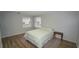 Serene bedroom with hardwood floors, neutral paint, and lots of natural light at 2618 Brookside Cir, Mount Dora, FL 32757