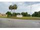 Dora Pines 55+ Resident Owned community sign with palm trees at 2618 Brookside Cir, Mount Dora, FL 32757