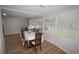 Open floorplan dining area featuring wood-look floors, neutral walls, and space to enjoy meals at 2618 Brookside Cir, Mount Dora, FL 32757