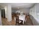 Open floorplan dining area featuring wood-look floors, neutral walls, and opening to kitchen and living areas at 2618 Brookside Cir, Mount Dora, FL 32757