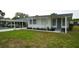 Inviting home featuring a carport, well-maintained lawn, and charming exterior details at 2618 Brookside Cir, Mount Dora, FL 32757