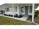 Image features the home's entrance, neat flower beds, and covered walkway at 2618 Brookside Cir, Mount Dora, FL 32757
