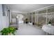Enclosed sunroom featuring lattice screens, neutral colors and a cozy, inviting atmosphere at 2618 Brookside Cir, Mount Dora, FL 32757