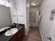 Clean bathroom featuring a single sink vanity and a shower-tub combo at 2691 Cypress Tree Trl, St Cloud, FL 34772