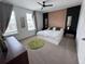 Stylish bedroom featuring modern wood paneling and plenty of natural light at 2691 Cypress Tree Trl, St Cloud, FL 34772