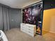 Spacious bedroom features an impressive Marvel character mural above a six-drawer dresser at 2691 Cypress Tree Trl, St Cloud, FL 34772