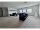 Large, bright game room with comfortable seating and plenty of space for activities at 2691 Cypress Tree Trl, St Cloud, FL 34772