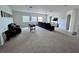 Large open living room with plenty of space for entertaining and comfortable seating at 2691 Cypress Tree Trl, St Cloud, FL 34772