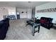 Spacious living area featuring neutral colors, a foosball table, and comfortable seating at 2691 Cypress Tree Trl, St Cloud, FL 34772