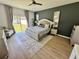 Inviting primary bedroom with queen bed, stylish furnishings, and ample natural light at 2691 Cypress Tree Trl, St Cloud, FL 34772
