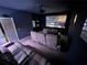 Comfortable media room with large screen, projector, and reclining leather seating at 2691 Cypress Tree Trl, St Cloud, FL 34772