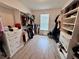 Organized walk-in closet with built-in shelving and drawers for efficient storage at 2691 Cypress Tree Trl, St Cloud, FL 34772