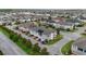 Aerial view of the neighborhood featuring well-maintained homes and landscaped streets in a neatly planned community at 2702 Giardino Loop, Kissimmee, FL 34741