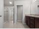 Bathroom featuring vanity, large mirror, and walk in shower with glass doors at 2702 Giardino Loop, Kissimmee, FL 34741