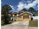 Charming single-story home with well-maintained landscaping and an attached garage at 2711 Emerson Ln, Kissimmee, FL 34743