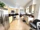 Functional kitchen featuring stainless steel appliances, tile floors and granite countertops at 2711 Emerson Ln, Kissimmee, FL 34743