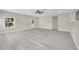 Bright, open living room with gray flooring, a ceiling fan, and neutral wall color at 308 E Orange St, Kissimmee, FL 34744