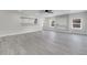 Open living room features recessed lights, a ceiling fan, lots of light, and decorative wall elements at 308 E Orange St, Kissimmee, FL 34744