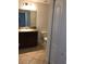 This bathroom features tile floors, a granite countertop, and a big mirror at 3319 Rodrick Cir, Orlando, FL 32824