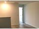 Upstairs hallway with hardwood floors and freshly painted walls at 3319 Rodrick Cir, Orlando, FL 32824