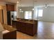 Kitchen with granite countertops, stainless steel appliances, and a breakfast bar overlooking the living space at 3319 Rodrick Cir, Orlando, FL 32824