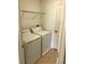 Laundry room with washer, dryer and wire shelves at 3319 Rodrick Cir, Orlando, FL 32824