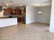 Open concept living space with tile floors flows into a dining area and kitchen at 3319 Rodrick Cir, Orlando, FL 32824
