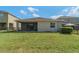 Spacious backyard with a screened patio, offering a tranquil outdoor space for relaxation and entertainment at 3589 Cortland Dr, Davenport, FL 33837