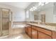 Elegant bathroom with tiled shower, soaking tub, dual sinks and granite vanity at 3589 Cortland Dr, Davenport, FL 33837