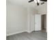 A well-lit bedroom with grey flooring and neutral walls, creating a serene and modern space at 3589 Cortland Dr, Davenport, FL 33837