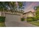 Charming home featuring a neutral color scheme, an attached two-car garage, and well-maintained landscaping at 3589 Cortland Dr, Davenport, FL 33837
