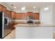 Modern kitchen featuring stainless steel appliances, granite countertops, and a central island at 3589 Cortland Dr, Davenport, FL 33837