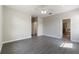 Main bedroom featuring wood floors, ceiling fan, and a doorway to the bathroom at 3589 Cortland Dr, Davenport, FL 33837