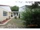 Backyard with grassy area and minimal landscaping, enclosed by neighboring properties at 386 San Jose Dr, Winter Haven, FL 33884