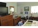 Bedroom with multiple dressers, decor, mirror, and painting on the wall at 386 San Jose Dr, Winter Haven, FL 33884