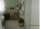 Bedroom with a small table and storage cabinet with sliding doors at 386 San Jose Dr, Winter Haven, FL 33884
