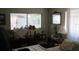 Bright bedroom featuring a window overlooking a garden, creating a serene and peaceful environment at 386 San Jose Dr, Winter Haven, FL 33884