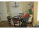 Dining room featuring chandelier, wooden table with chairs, and charming decorative accents at 386 San Jose Dr, Winter Haven, FL 33884