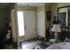 Inviting entryway featuring tiled floors, a chandelier, and a classic white front door at 386 San Jose Dr, Winter Haven, FL 33884
