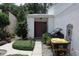 Charming home entrance with a red door and well-maintained landscaping at 386 San Jose Dr, Winter Haven, FL 33884