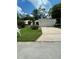 Charming single-story home with a well-maintained lawn and a two car garage, perfect for a small Gathering at 386 San Jose Dr, Winter Haven, FL 33884